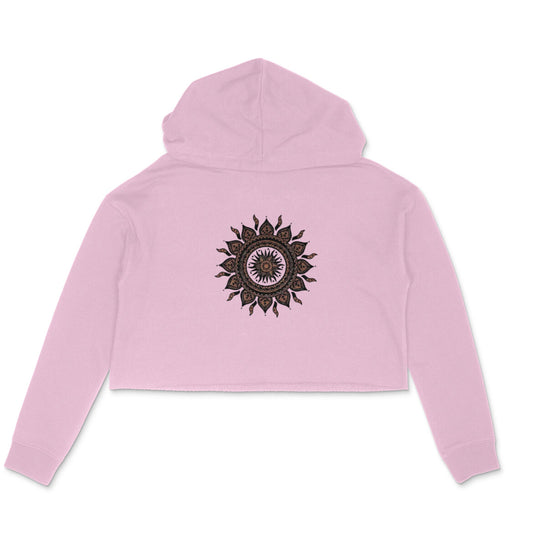 Pink cropped hoodie with a black mandala design on a white background