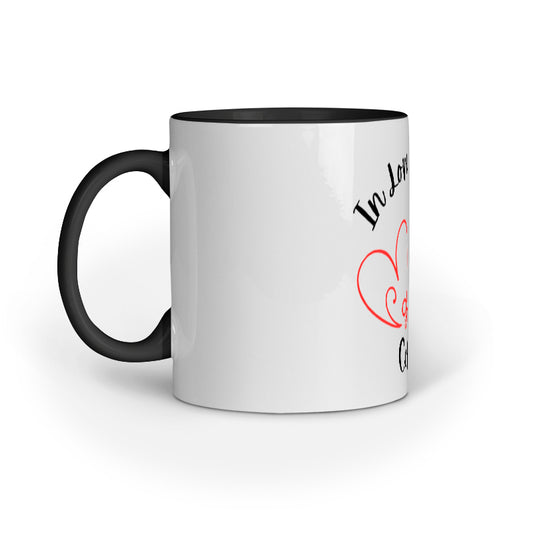White mug with black handle and text on a white background