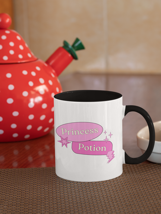 White mug with 'Princess Potion' text on a kitchen counter with a red polka dot teapot.